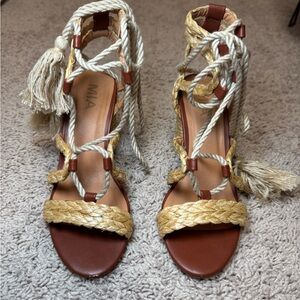 Heels with wrap around ankle feature